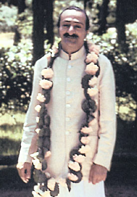 Meher Baba wearing his white coat.